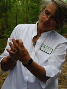 Susan Scherf a museum educator holding a woodland frog