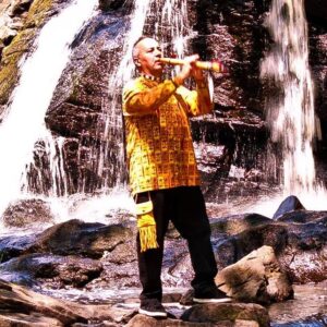 Allan Madahbee playing one of his handcrafted flutes