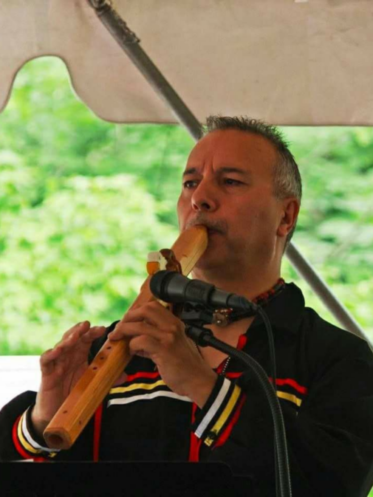 Allan Madahbee playing a traditional flute