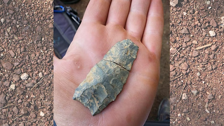Someone holding an artifact in their hands.